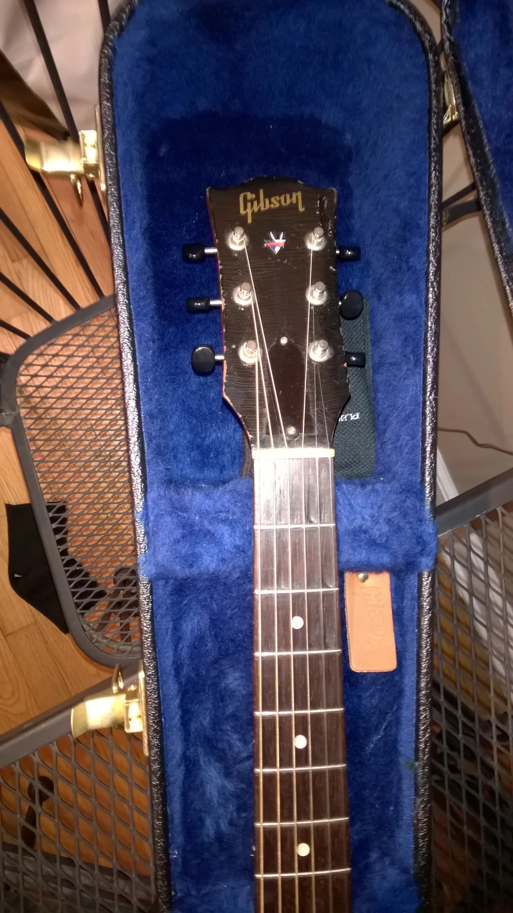 Sighting down the neck from the headstock to see whether it is straight. Photo: sbaimo, CC BY 2.0